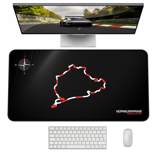 Black desk mat with Nurburgring design, computer monitor, keyboard, and mouse on a white background