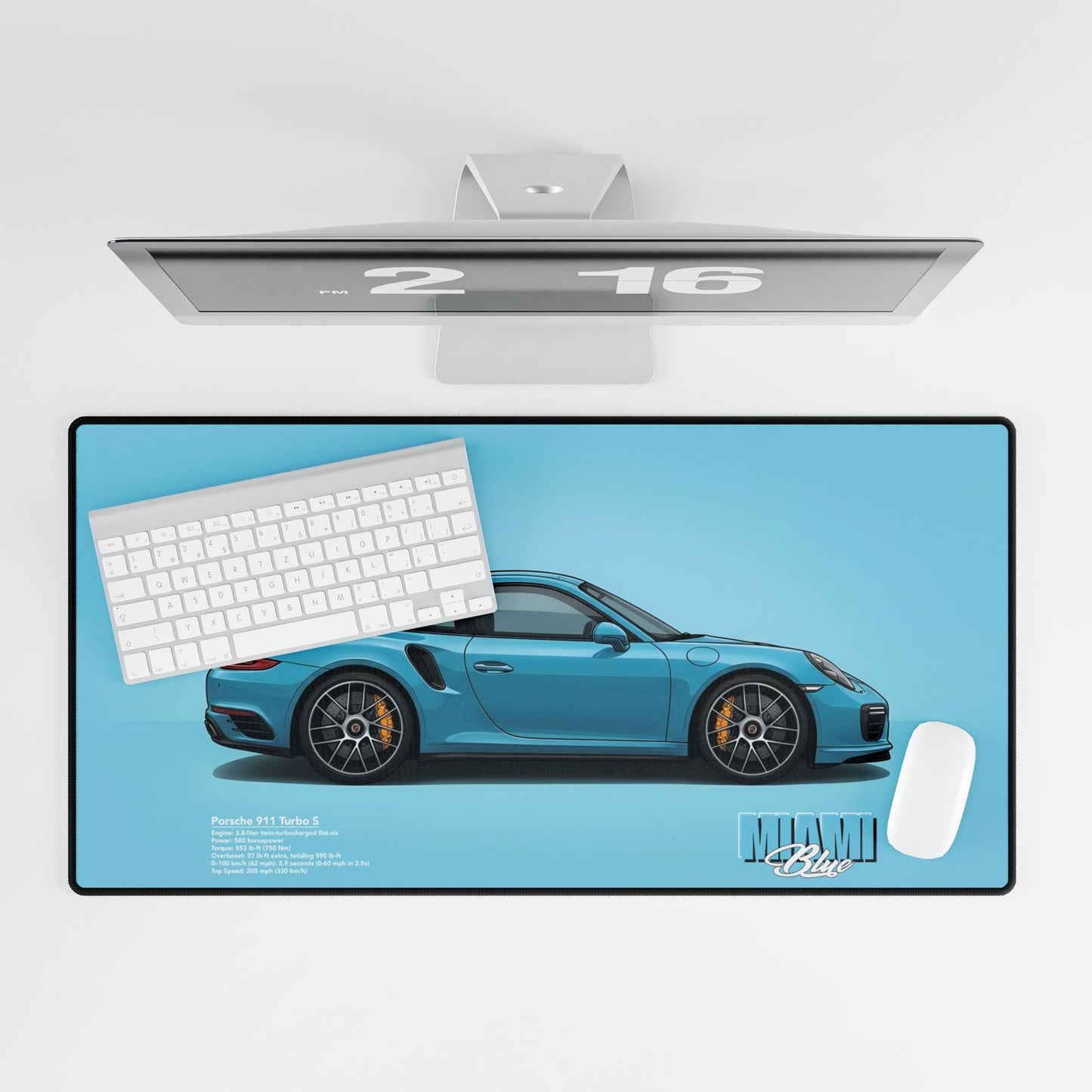 Desk setup with a 911 Turbo S mouse pad, keyboard, and computer monitor.