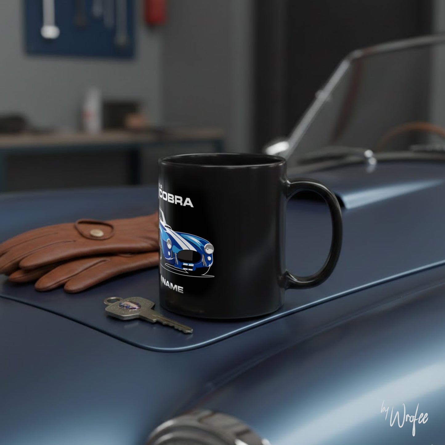 Black mug with car design on a car hood with gloves and keys