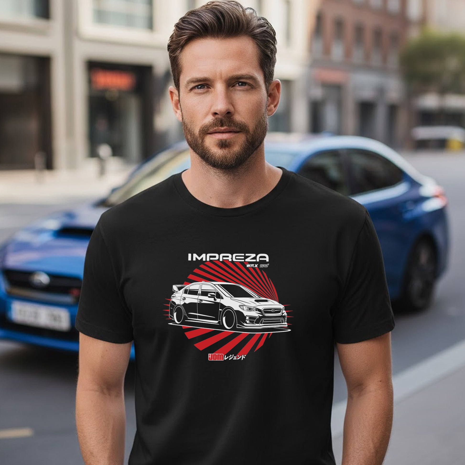 Man wearing a black t-shirt with a car graphic and 'Impreza' text, standing on a street.