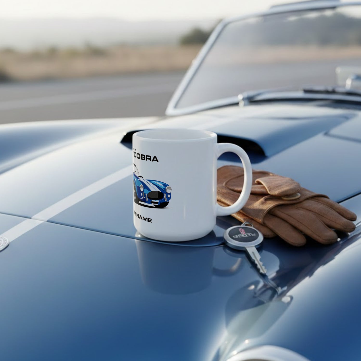 Cobra mug on a classic car with gloves and keychain