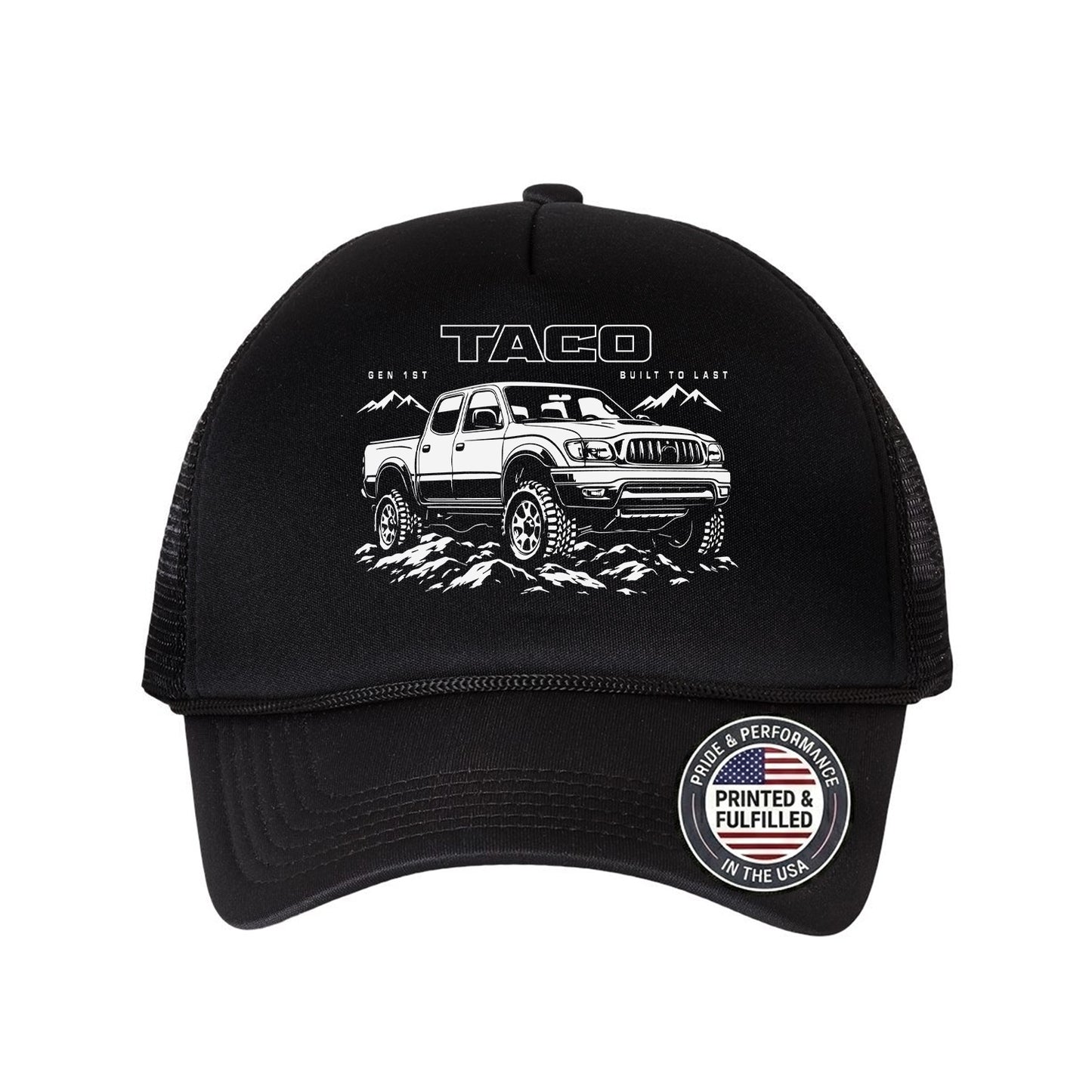 A black trucker hat featuring a white graphic of a Tacoma truck on the front, with 'TACOMA' and 'BUILD TO LAST' printed above it. The back of the cap has black mesh panels, and there is a circular 'Printed & Fulfilled' sticker on the brim.