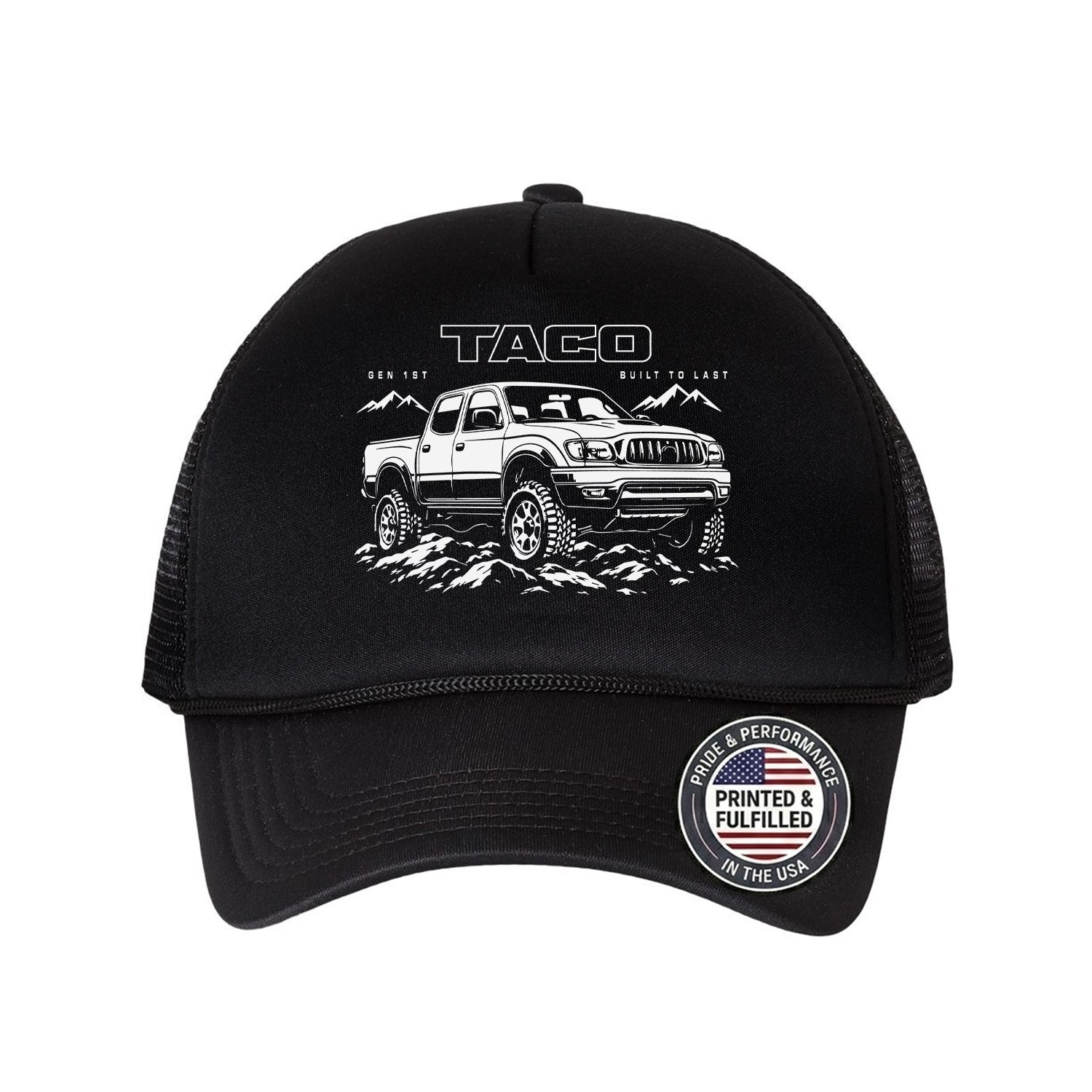 A black trucker hat featuring a white graphic of a Tacoma truck on the front, with 'TACOMA' and 'BUILD TO LAST' printed above it. The back of the cap has black mesh panels, and there is a circular 'Printed & Fulfilled' sticker on the brim.
