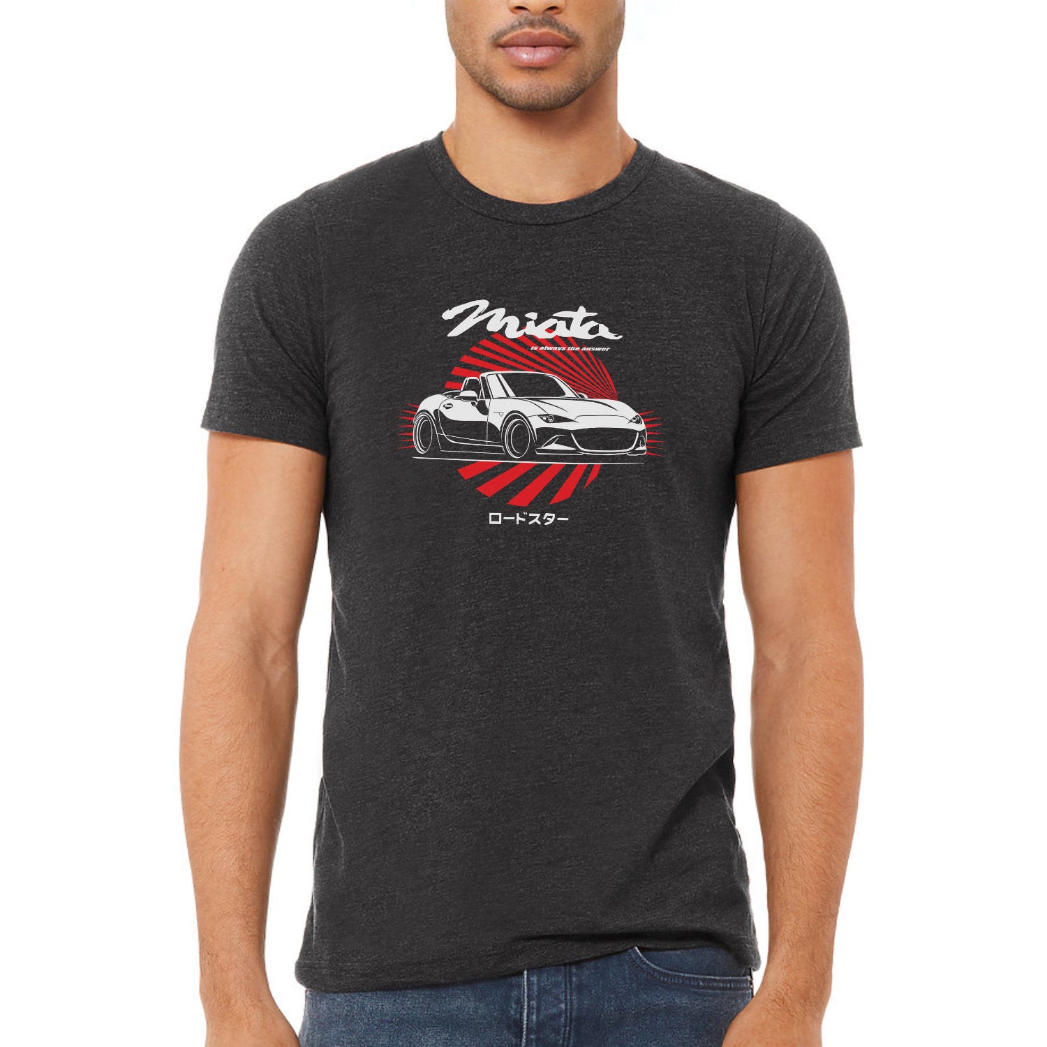 Person wearing a black t-shirt with a car graphic and 'Miat' text on a white background