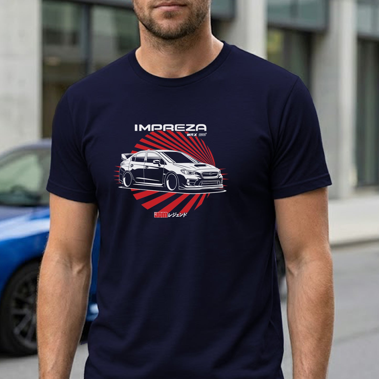 Person wearing a navy blue t-shirt with a car graphic and 'Impreza' text.